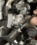 Mechanic using 12 Piece One Quarter Inch Drive Metric Flex Socket Set With 6 Point Sockets From 5mm To 15mm on engine part.