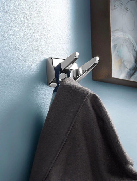 Donnor Collection Chrome Wall Mount Hand Towel Ring 6.25 Inch Diameter installed on blue bathroom wall with towel