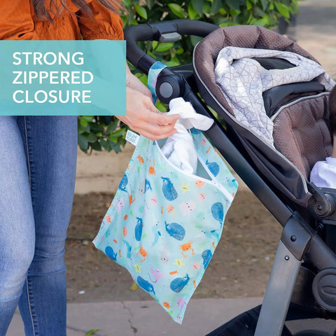 Waterproof Wet Dry Bag For Travel And Baby Gear, reusable ocean life print pouch attached to stroller with zippered closure.