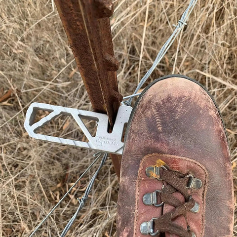 Heavy Duty Aluminum T Post Fence Step With Integrated Nylon Pouch Rock Solid Grip on a T post with a boot stepping on it.