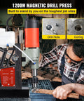 Heavy Duty 1200W Magnetic Drill Press With 40mm Capacity Bores Through Tough Steel Structures Easily with drilling action in workshop.