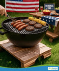 Outdoor BBQ with burgers and corn on a grill, picnic table in background, using Heavy Duty Disposable Aluminum Grill Liners 12 x 20 Inch Nonstick Sheets