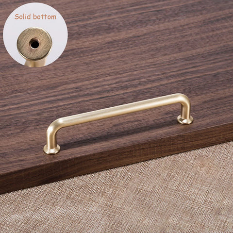 10 Pack 5 Inch Center To Center Brushed Brass Kitchen Cabinet Pulls Zinc Alloy Solid Round Cabinet Handles mounted on wood surface