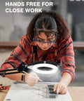 Hands Free Desk Magnifier With Light 10X And 5X Real Glass Anti Glare Lens, used by woman crafting at desk