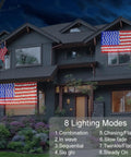 Solar American Flag Net Lights Outdoor 420 LEDs 6.5ft By 3.28ft on house, illuminated at night with multiple lighting modes.