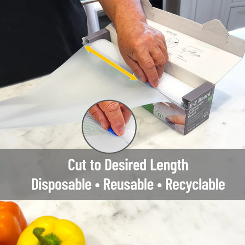 EZ Board Disposable Plastic Cutting Board For Quick Cleanup And Easy Food Prep On The Go being cut to size from box.