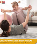 Mother on rug lifting child, illustrating safe play on Nonskid Rug Pad 3' x 5' Plush Reversible Gripper One Quarter Inch Thick.