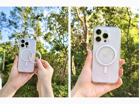 Person holding an iPhone with a slick clear magnetic base for PopSocket grips, compatible with MagSafe accessories, in a nature setting.