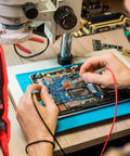 Digital Multimeter 4000 Counts TRMS Auto Ranging AC DC Voltmeter Ohm Amp Tester With NCV Live Test in use on circuit board.