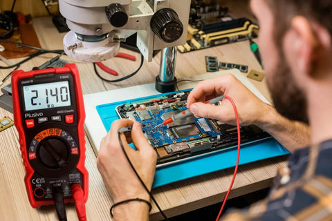 Digital Multimeter 4000 Counts TRMS Auto Ranging AC DC Voltmeter Ohm Amp Tester With NCV Live Test in use on circuit board.