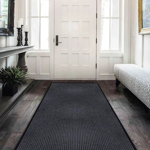 Extra Large Heavy Duty Commercial Entrance Rug Top Notch Walk Off Mat Built Tough For Heavy Foot Traffic Water Resistant Boot Scraper Gray Floor Mat in an entryway.