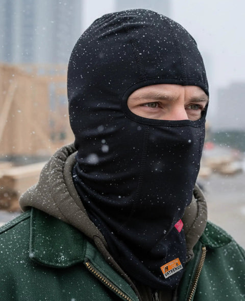 Person wearing Flame Resistant Balaclava Hood For Welding 7oz Cotton FR Face Mask Arc Rated NFPA 2112 CAT2 in snowy weather