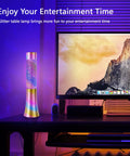 Color Changing Glitter Lamp USB Powered Mood Light For Bedrooms And Parties Teens And Kids Gift Floating Sequins Vibe Lamp Neon Decor For Adults And Youths glowing beside a computer on a desk.