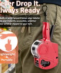 Red MX5500 Price Tag Gun clipped to belt with lanyard in a retail store setting