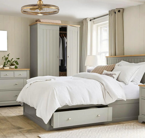 Industrial Cage Fandelier Ceiling Fan With Remote Control And Integrated Led Light Warm Brass hanging above a cozy bedroom.