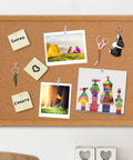 235 Piece Push Pin And Thumb Tack Assortment Kit With Clear Clips Rose Gold Hooks and map markers on a cork bulletin board.