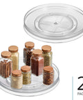Two clear 11 Inch Round Lazy Susan Organizer For Kitchen And Pantry Storage Set Of 2 Smooth Rotating Turntables with spices.
