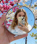 Handheld Convex Mirror Set Portable Shatter Resistant Lens Create Wide Angle Photos Perfect For Solo And Group Vibes While Keeping Gear Safe For Easy Travel Always Fits In Purse Or Backpack No Drama Snaps Guaranteed Today Lets See This, image of user taking a selfie with a convex mirror outdoors.