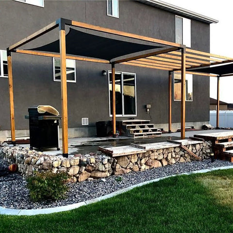 6x6 Pergola Bracket Kit With Powder Coated Carbon Steel Post Brackets installed on outdoor patio with stone foundations.