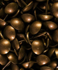 500 Piece Antique Copper Upholstery Nails And Furniture Tacks Set For An Old School Vintage Vibe In French Natural Decor, visible in close-up.