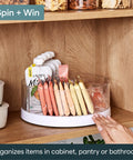 Smooth As Butter Three Bin Rotating Lazy Susan Turntable for cabinet organization with clear containers and snacks.
