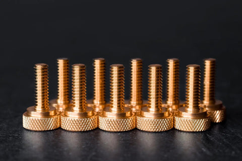 Top Shelf Brass Knurled Thumb Screws Ten Pack One Quarter Twenty Thread Three Quarter Inch Length, 10 shiny gold screws aligned.