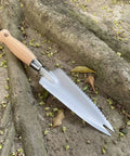 13.3 Inch Alloy Steel Garden Trowel With Forked Tip And Depth Markings for root cutting on woodland ground