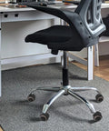 Grey Caster Wheels 10pcs Inch for Office Chair and Sofa on a black office chair in a workspace setting.