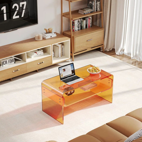 Orange Acrylic Coffee Table With Open Storage Two Tier Clear Modern Coffee Table For Living Room Office Reception And Bedroom Transparent Side Table With A Dope See Through Look And Durable Build in a living room with a laptop and bowl on top.