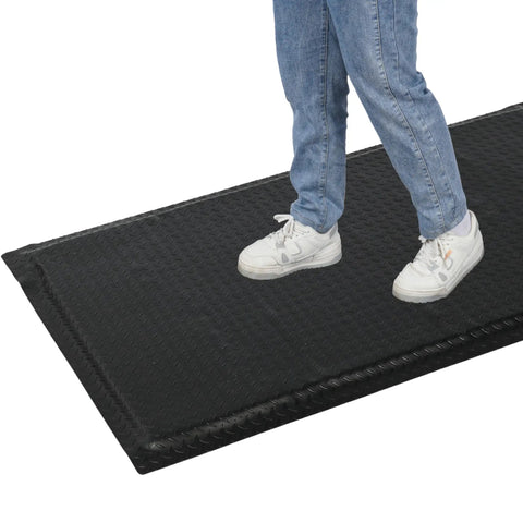 Person standing on Heavy Duty Anti Fatigue Floor Mat Built For Long Shifts 3 Ft By 7 Ft Thick Fifteen Sixteenths Inch Ergonomic Standing Mat.