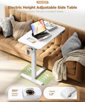Yolezo 24 By 16 Inch Electric Overbed Table With Rolling Wheels And Smooth Height Adjustment Up To 47 Inches, White Laptop Desk For Bed on a sofa.