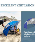 UPF 50 Plus Go-To Sun And Rain Canopy Umbrella For Beach, Sports, And Camping with airflow windows on a sandy beach