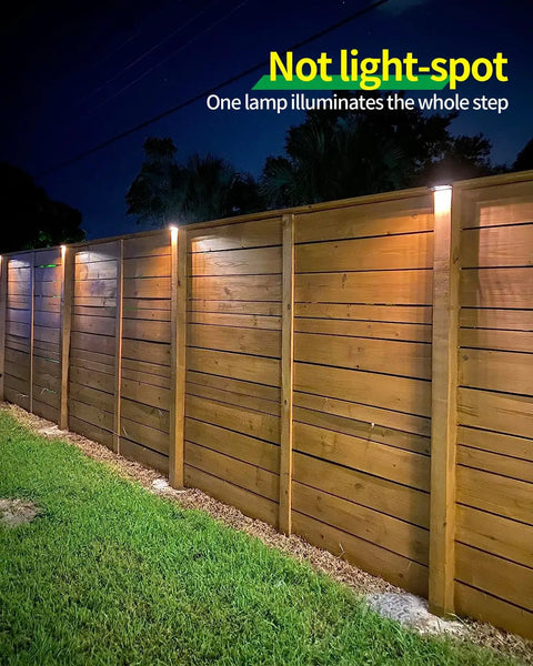 Outdoor Solar Deck Lights Set Of 6 Dope 7 Color RGB Waterproof Step Lights illuminating wooden fence at night
