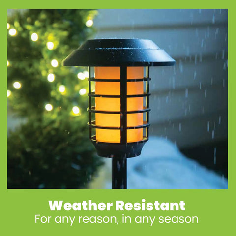 Color Changing Solar Pathway Lights Outdoor IP67 Waterproof Solar Powered Garden Lights For Walkways Yard Backyard Lawn Or Landscape 4 Pack With Auto Color Cycling And Energy Saving LED shown in rain highlighting weather resistance.
