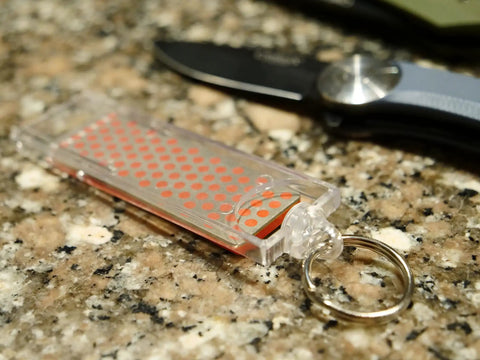 Pocket Diamond Sharpener With Monocrystalline Diamond Surface, Ultra Portable Keychain F70F Fine Grit Sharpener on a counter