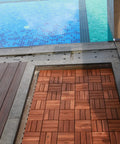 Teak Interlocking Patio Deck Tiles Set of 10 12 Inch by 12 Inch Outdoor Wood Flooring Mats installed by a poolside