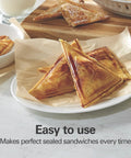 Hamilton Beach Electric Sealed Sandwich Maker Grill For Hot Pockets And Grilled Cheese creates sealed and toasted sandwiches on a plate.