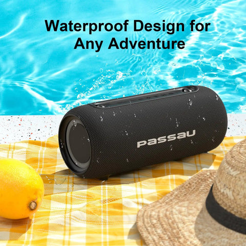 Portable Bluetooth Speaker With 40W Peak Power And Deep Bass From Dual Passive Radiators by poolside with water droplets.