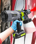Person using Cordless HVLP Paint Sprayer With 2 Batteries And Charger, 3 Copper Nozzles And 3 Spray Patterns, 800ml Cup