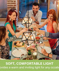 Group enjoying dinner under pendant lights showcasing E12 Candelabra LED Bulbs 40W Equivalent, 48 Pack, CA10 Flame Tip, 2700K Soft White.