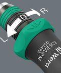 Close-up of Bitholding Ratcheting Screwdriver With Rapidaptor Quick Release Chuck showing rotation direction on handle.