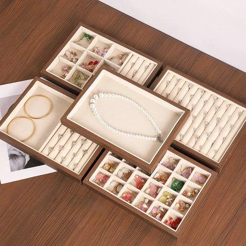 Slick Walnut Wood Jewelry Display Tray With Dope 24 Compartments For Rings Earrings Necklaces with assorted jewelry inside.