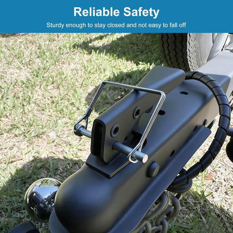 Close-up of a 8 Pack Trailer Hitch Pin One Quarter Inch Standard Pins With Safety Lock And Locking Retainer attached to a tractor hitch.