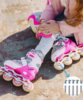 Child wearing pink roller blades with 6mm Inline Skate Axle Screws Set, 15/64 Inch Shaft, 35mm Working Length, Hex Socket Bolts.
