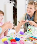 Family enjoying craft time with 113 Piece Crochet Kit With 1600 Yards Of 40 Color Assorted Acrylic Yarn For Knitting And Crochet