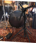 Rock Solid Foldable Drum Stand Adjustable Tripod Rack For 12 Inch Snare Drum Heavy Duty Alloy Build positioned near drum kit.