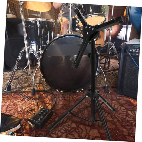 Rock Solid Foldable Drum Stand Adjustable Tripod Rack For 12 Inch Snare Drum Heavy Duty Alloy Build positioned near drum kit.