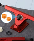 Skateboard Truck Bushings 2 Pack 90A PU Longboard Rebuild Kit with Cylinder and Tapered Bushings in Orange, close-up view