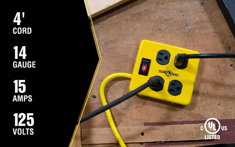 Heavy Duty Metal Power Block With Four Grounded Outlets, Lighted Switch, Four Foot Yellow Cord, 14 Gauge, 15 Amp Circuit Breaker in workshop.