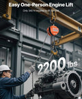 1 Ton Hand Chain Hoist with 10 Ft Lift Galvanized G80 Chain lifting an engine, showcasing easy engine lift capability in a warehouse.